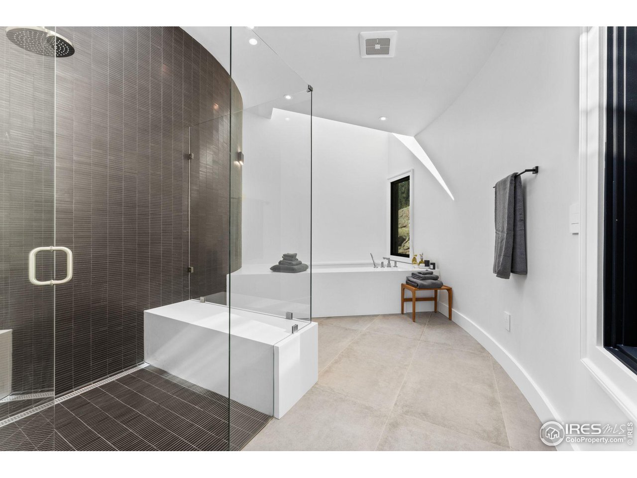 855 Timber Lane Boulder, CO 80304 - Photo 24 of 40 a bedroom with a bed and a mirror