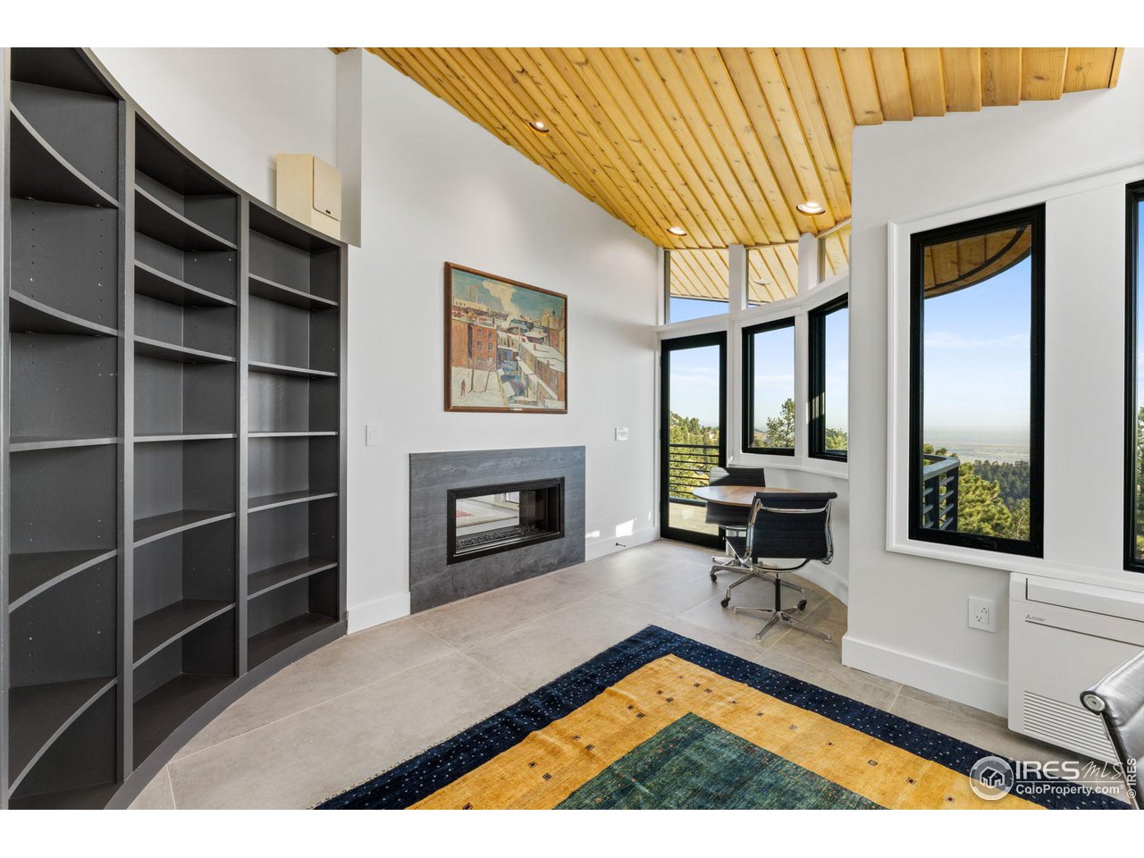 855 Timber Lane Boulder, CO 80304 - Photo 27 of 40 a living room with a couch and a fireplace