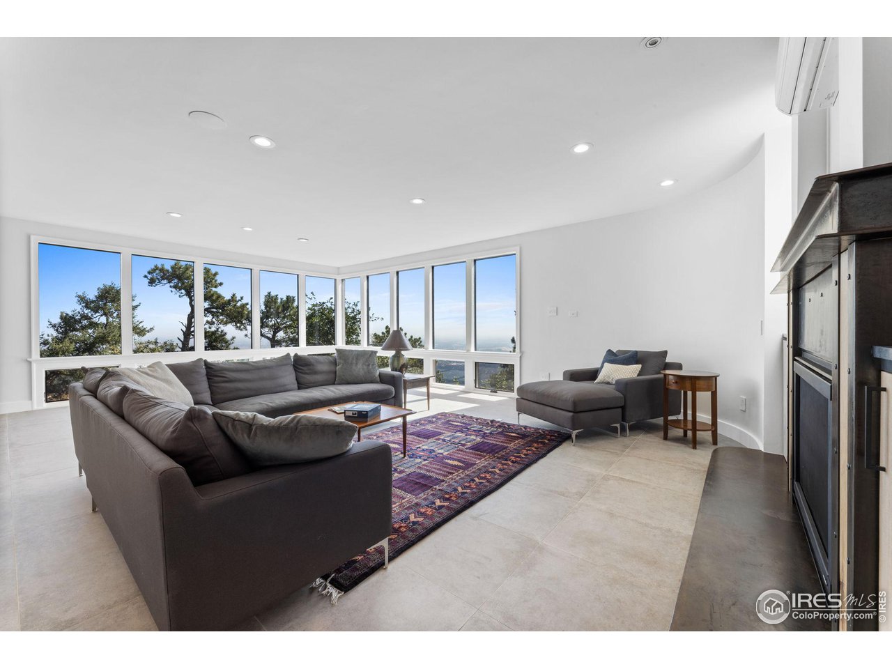 855 Timber Lane Boulder, CO 80304 - Photo 28 of 40 a living room with furniture and a flat screen tv