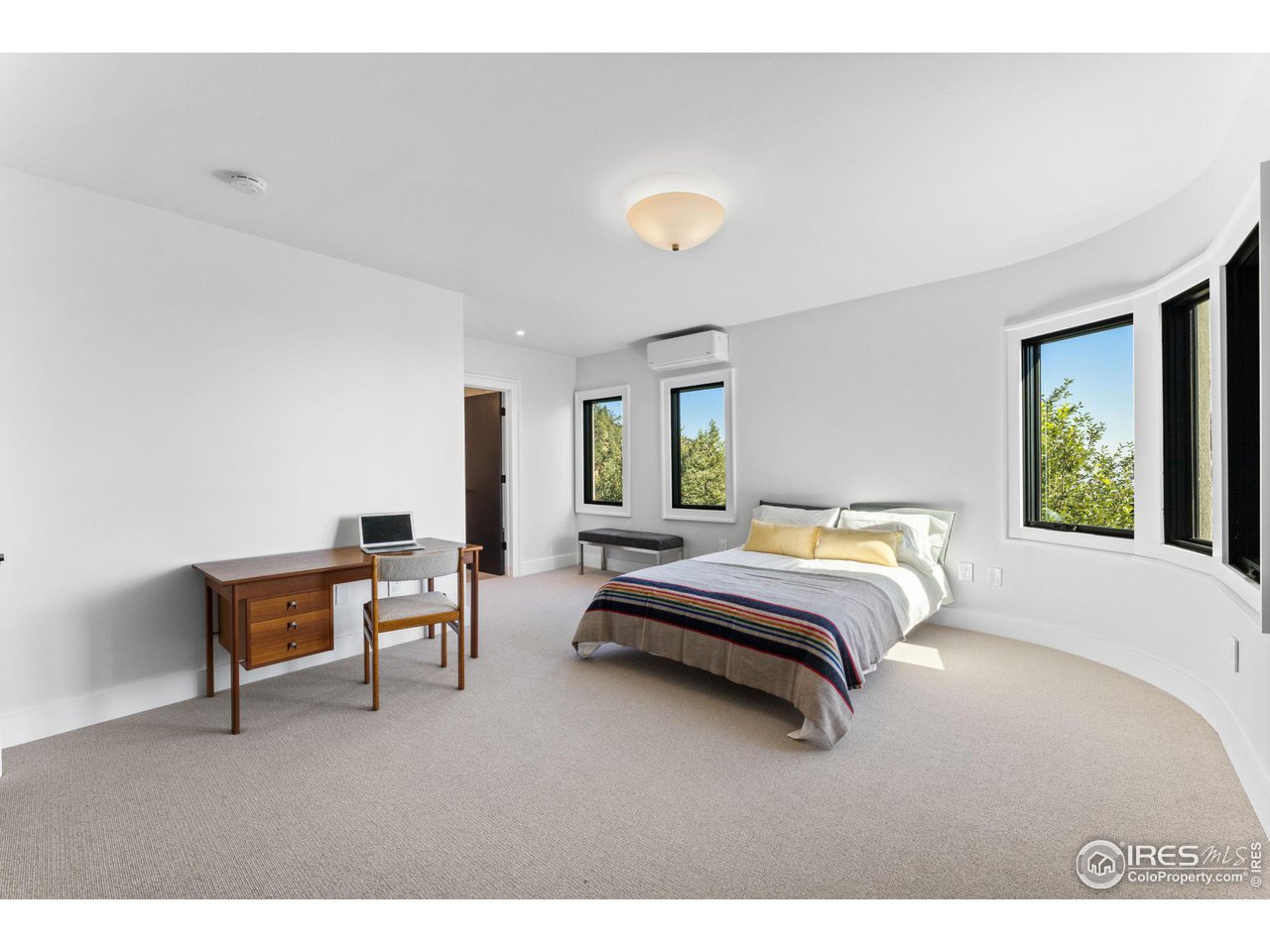 855 Timber Lane Boulder, CO 80304 - Photo 31 of 40 a bedroom with a bed and a table