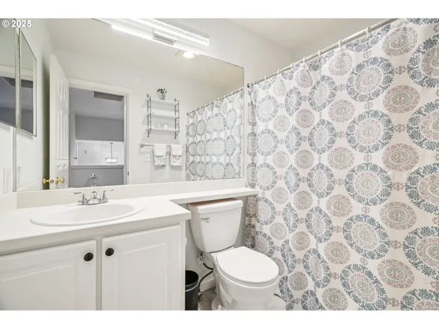 a bedroom with a bed with large window