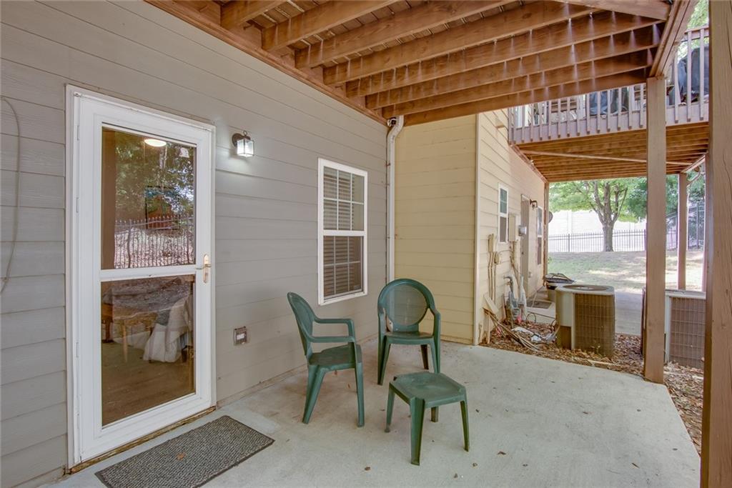 2799 Keystone Avenue Lithonia, GA 30058 - Photo 12 of 41 a patio with table and chairs