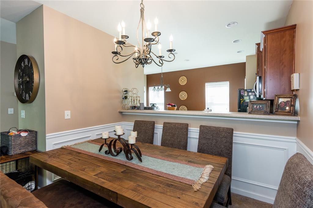 2799 Keystone Avenue Lithonia, GA 30058 - Photo 18 of 41 a view of a dining hall with furniture and chandelier