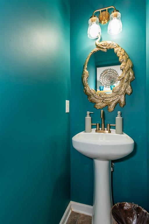 2799 Keystone Avenue Lithonia, GA 30058 - Photo 21 of 41 a bathroom with a sink and mirror
