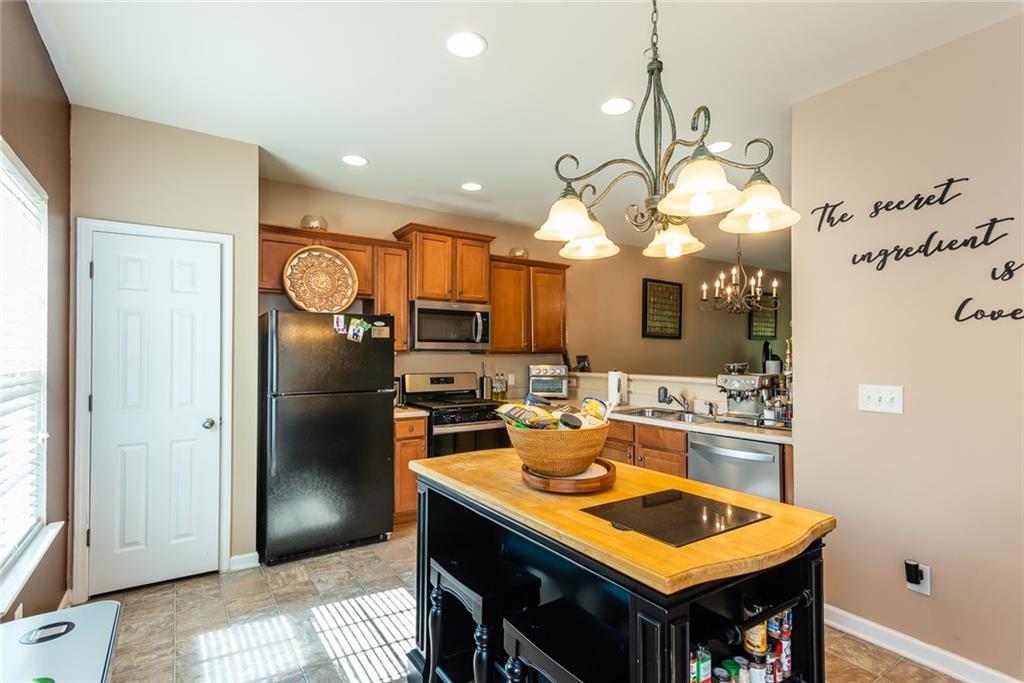 2799 Keystone Avenue Lithonia, GA 30058 - Photo 23 of 41 a kitchen with a table and chairs in it