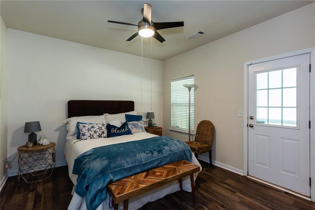 2799 Keystone Avenue Lithonia, GA 30058 - Photo 8 of 41 a bedroom with a bed a window and chair