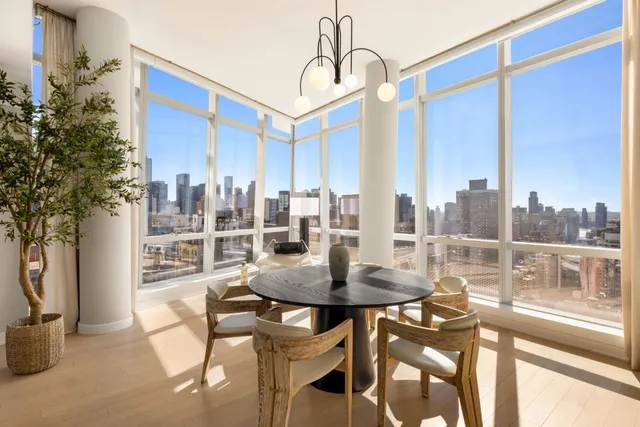 a view of a dining room with furniture window and outside view