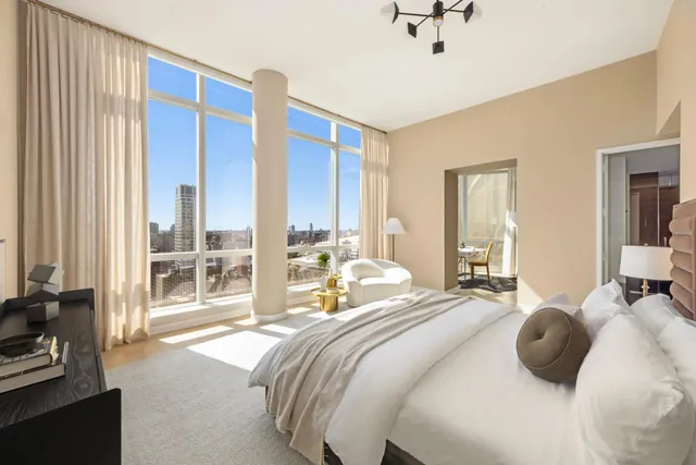 a bedroom with a bed and glass walk in closet