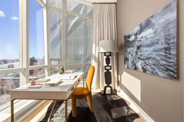 a view of a dining room with furniture and window