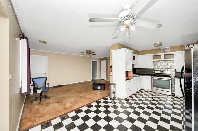 a view of an empty room with a window