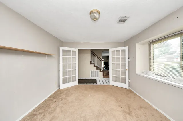 a view of an empty room with a window