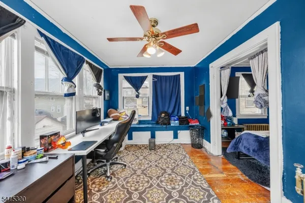 a living room with furniture a rug and a chandelier