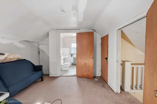 a view of empty room with closet and fan