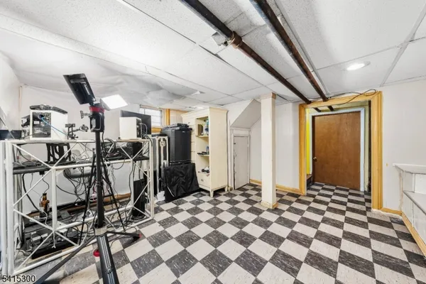 a very nice looking room with a black white checkered floor