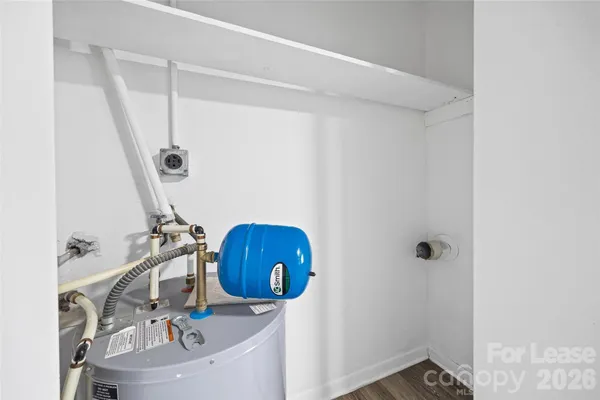 a bathroom with a sink toilet a mirror and shower