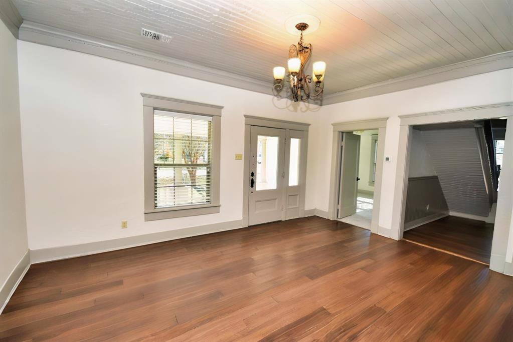 269 Holley Street Alba, TX 75410 - Photo 11 of 37 a view of an empty room with wooden floor and a window