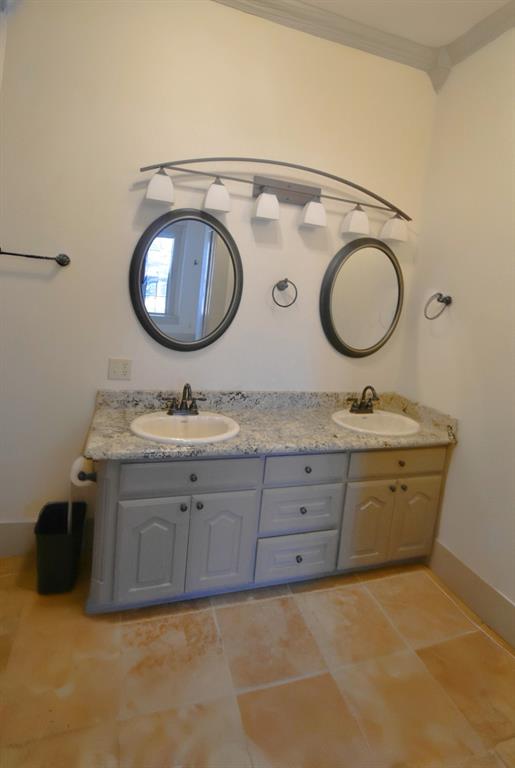 269 Holley Street Alba, TX 75410 - Photo 24 of 37 a bathroom with a granite countertop double vanity sink and mirror