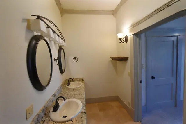 a bathroom with a sink a toilet and a shower