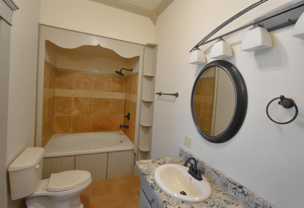 269 Holley Street Alba, TX 75410 - Photo 26 of 37 a bathroom with a sink a toilet and a shower