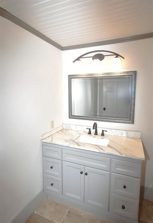 269 Holley Street Alba, TX 75410 - Photo 28 of 37 a bathroom with a granite countertop sink and a mirror