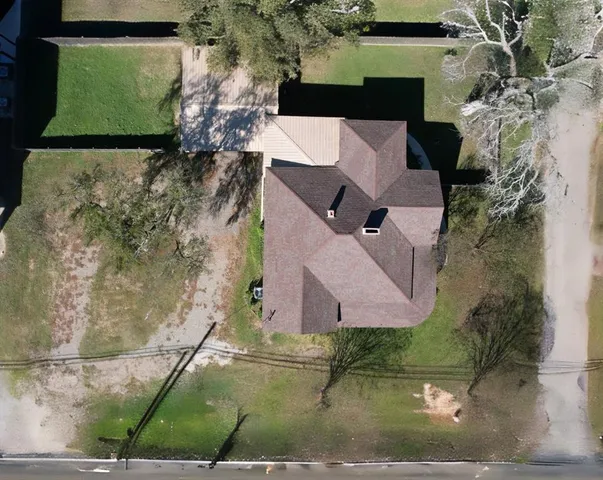 an aerial view of residential houses with outdoor space
