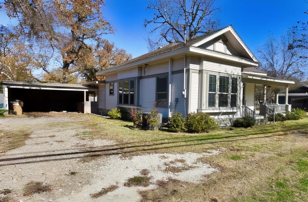 269 Holley Street Alba, TX 75410 - Photo 5 of 37 a front view of a house with a yard and garage