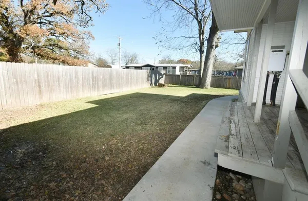 a view of a back yard of the house