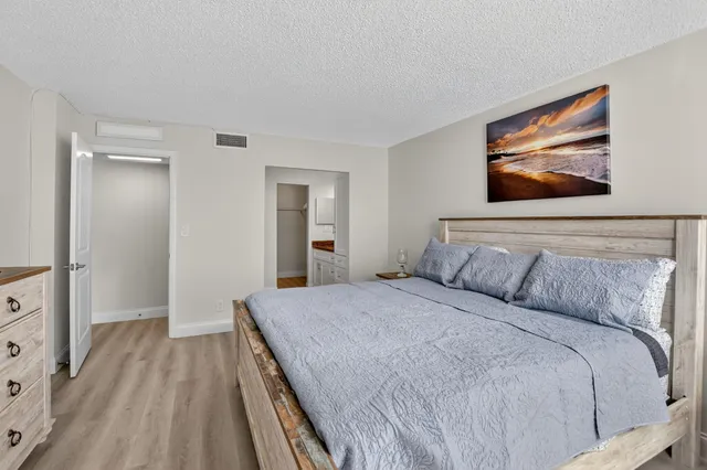 a view of a house with backyard and deck