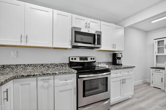 a view of a backyard with sitting area and furniture