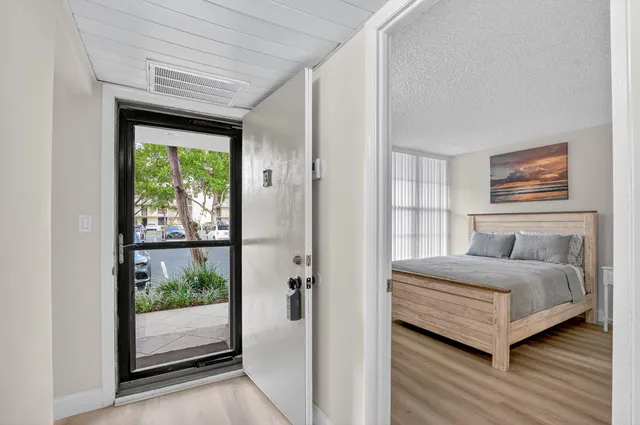 a kitchen with stainless steel appliances a stove microwave and a refrigerator