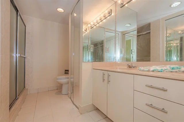 a bathroom with a glass shower door