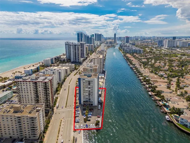 an aerial view of a city with ocean view