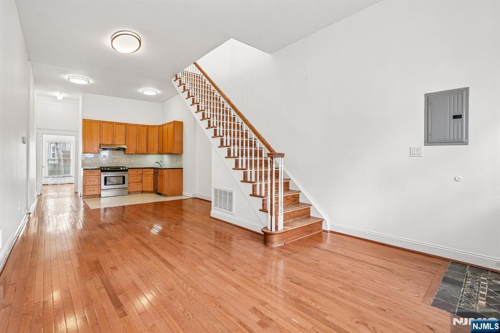 90 A Hackensack Plank Road Weehawken, NJ 07086 - Photo 7 of 40 a view of room with wooden floor and staircase