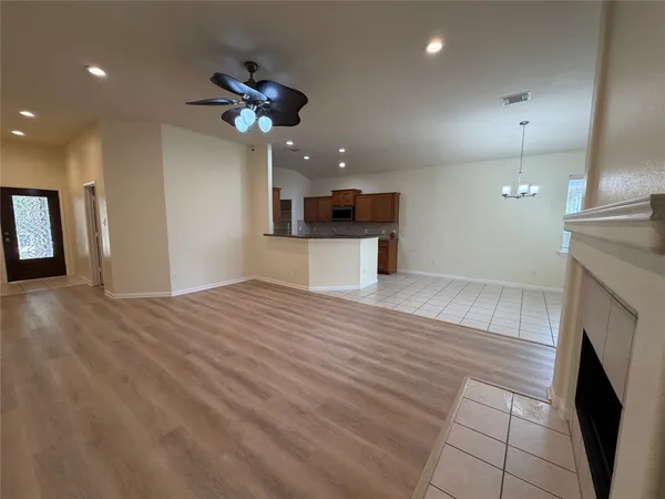 a kitchen with granite countertop a sink cabinets and stainless steel appliances