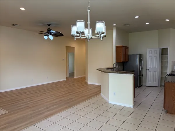 a spacious bathroom with a double vanity sink mirror and shower