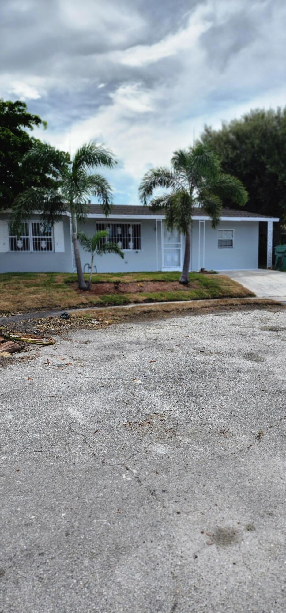 1580 Evergreen Court Riviera Beach, FL 33404 - Photo 1 of 19 20220826_155354
