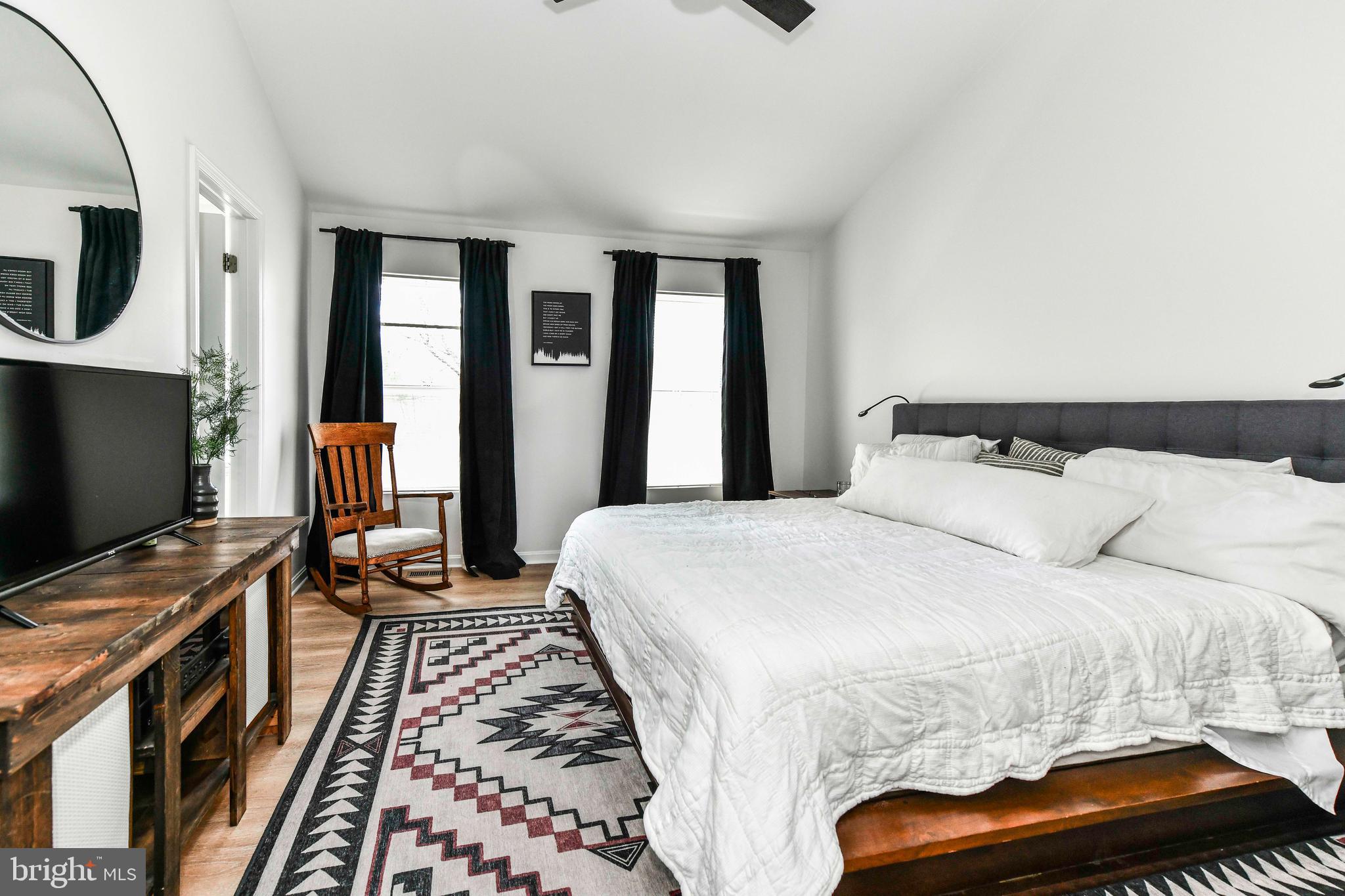 12066 Edgemere Circle Reston, VA 20190 - Photo 21 of 28 a bedroom with a bed and a flat screen tv