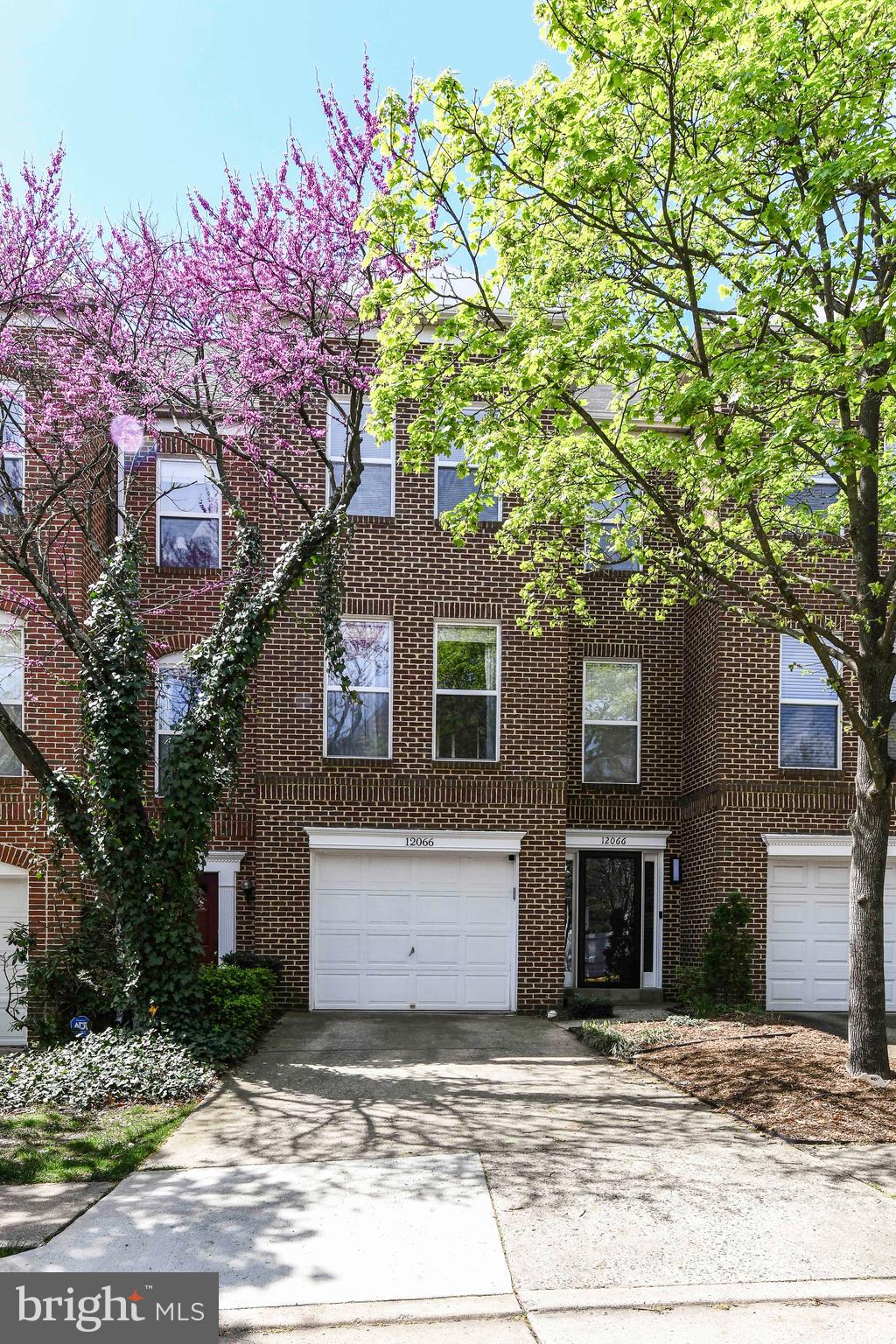12066 Edgemere Circle Reston, VA 20190 - Photo 27 of 28 a front view of a house with a tree
