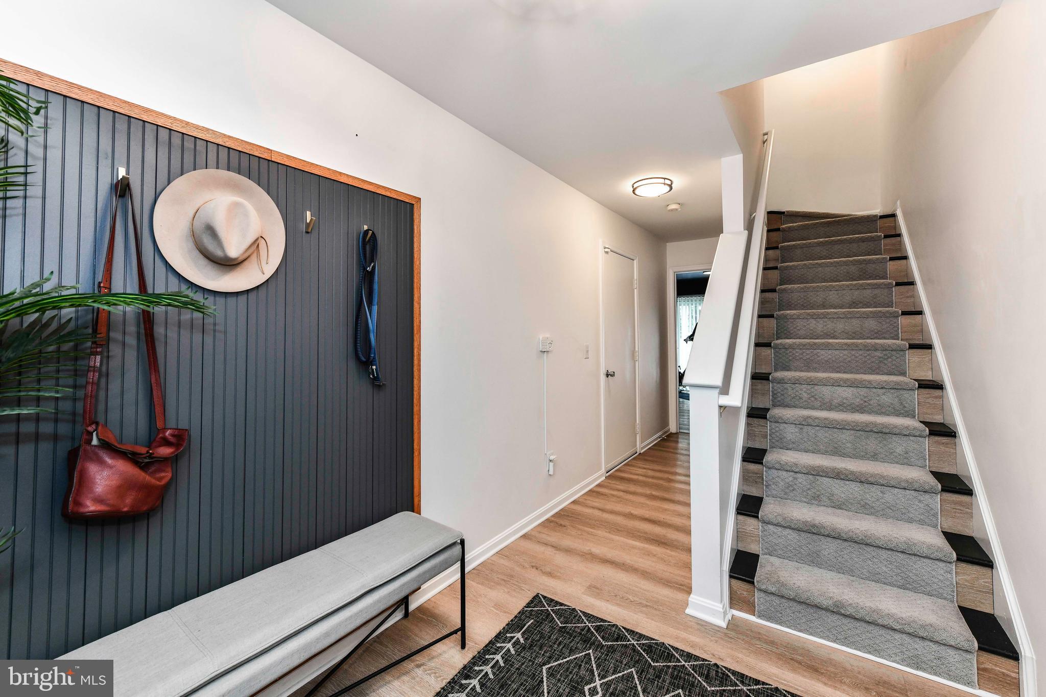 12066 Edgemere Circle Reston, VA 20190 - Photo 4 of 28 a view of a hallway with entryway and wooden floor