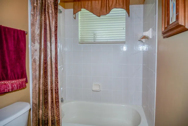 a bedroom with a bed and a baby crib