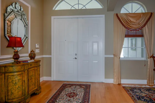 a view of a dining room with furniture and chandelier