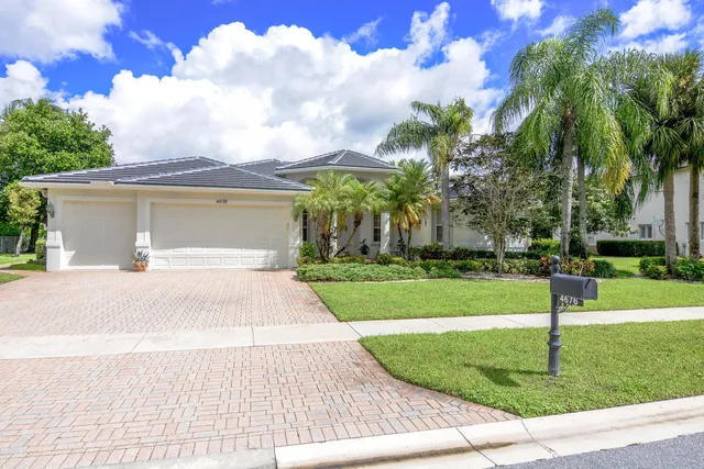 a view of outdoor space with playground and green space