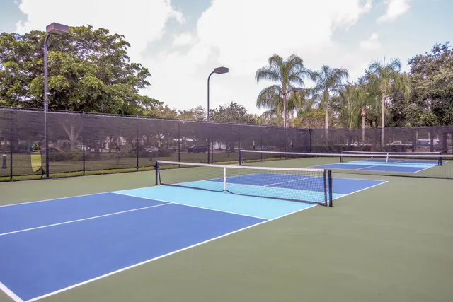 a view of swimming pool with a table and chairs