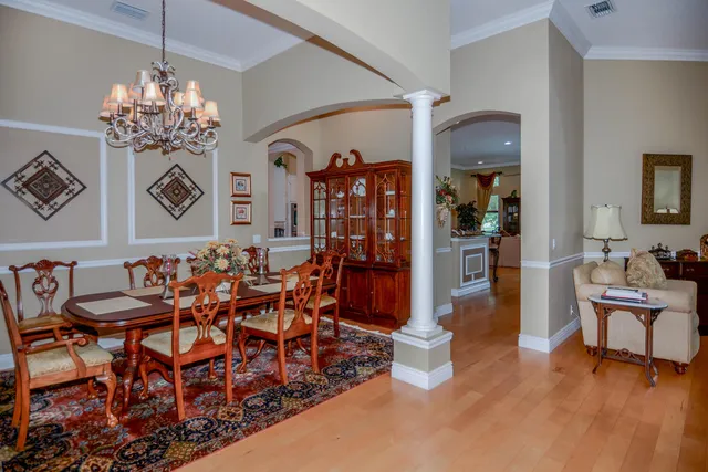 a dining room with furniture and window