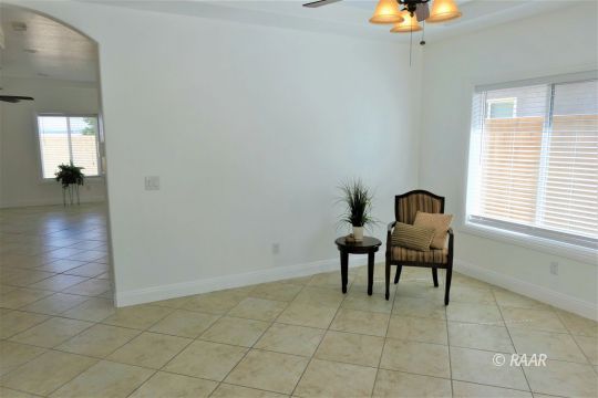 1516 Mayo Street Ridgecrest, CA 93555 - Photo 6 of 33 a view of a workspace room with wooden floor and lounge chair