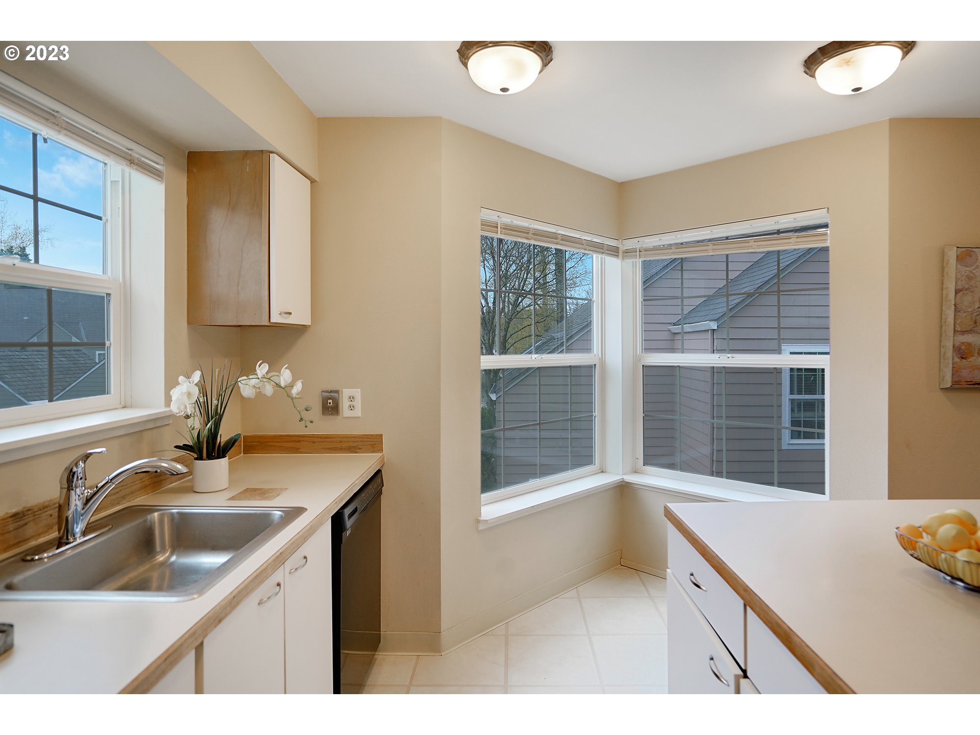 8415 Southwest Curry Drive, Unit A Wilsonville, OR 97070 - Photo 11 of 36 a kitchen with a sink and a window