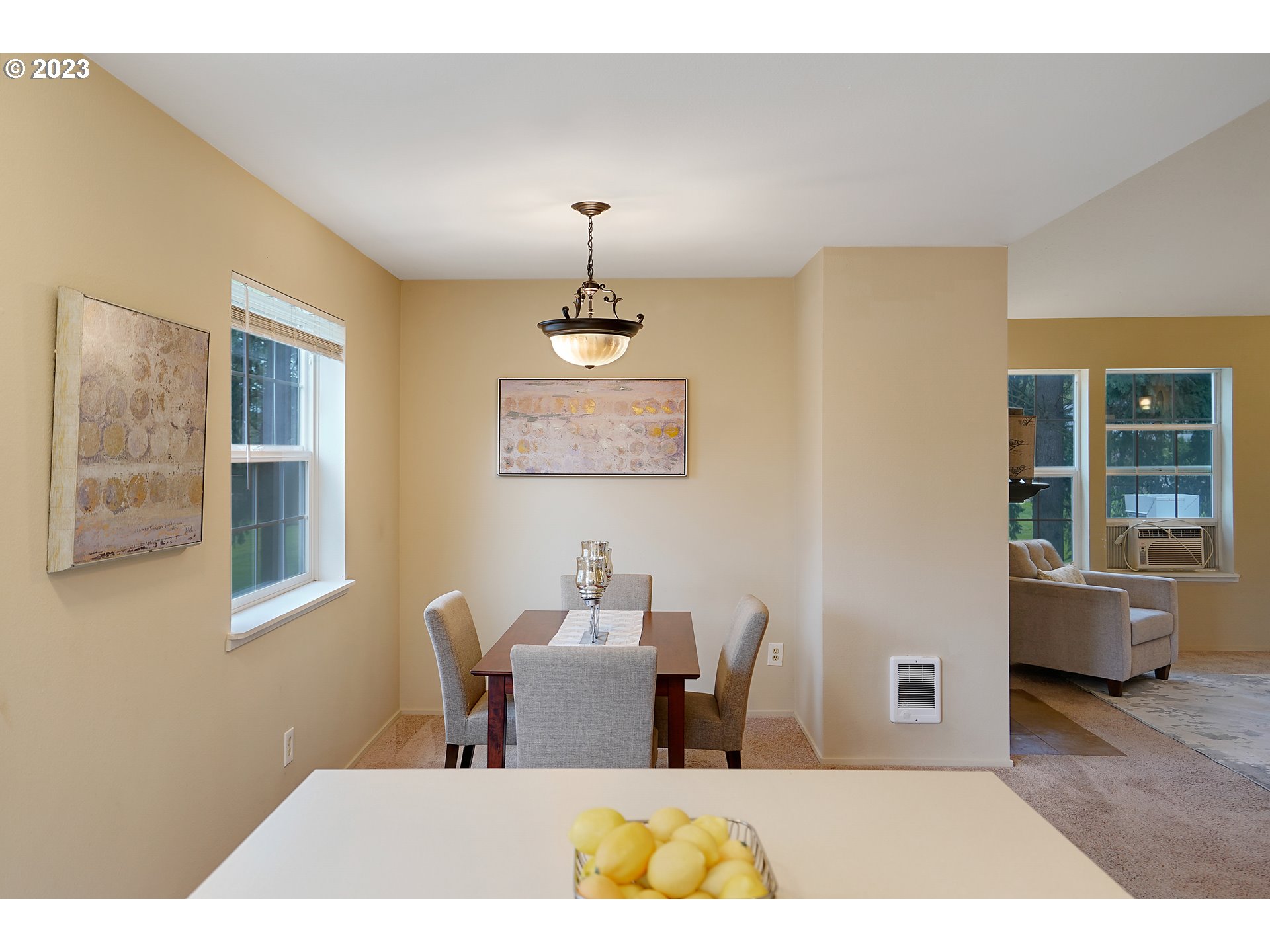 8415 Southwest Curry Drive, Unit A Wilsonville, OR 97070 - Photo 16 of 36 a bedroom with furniture and a chandelier