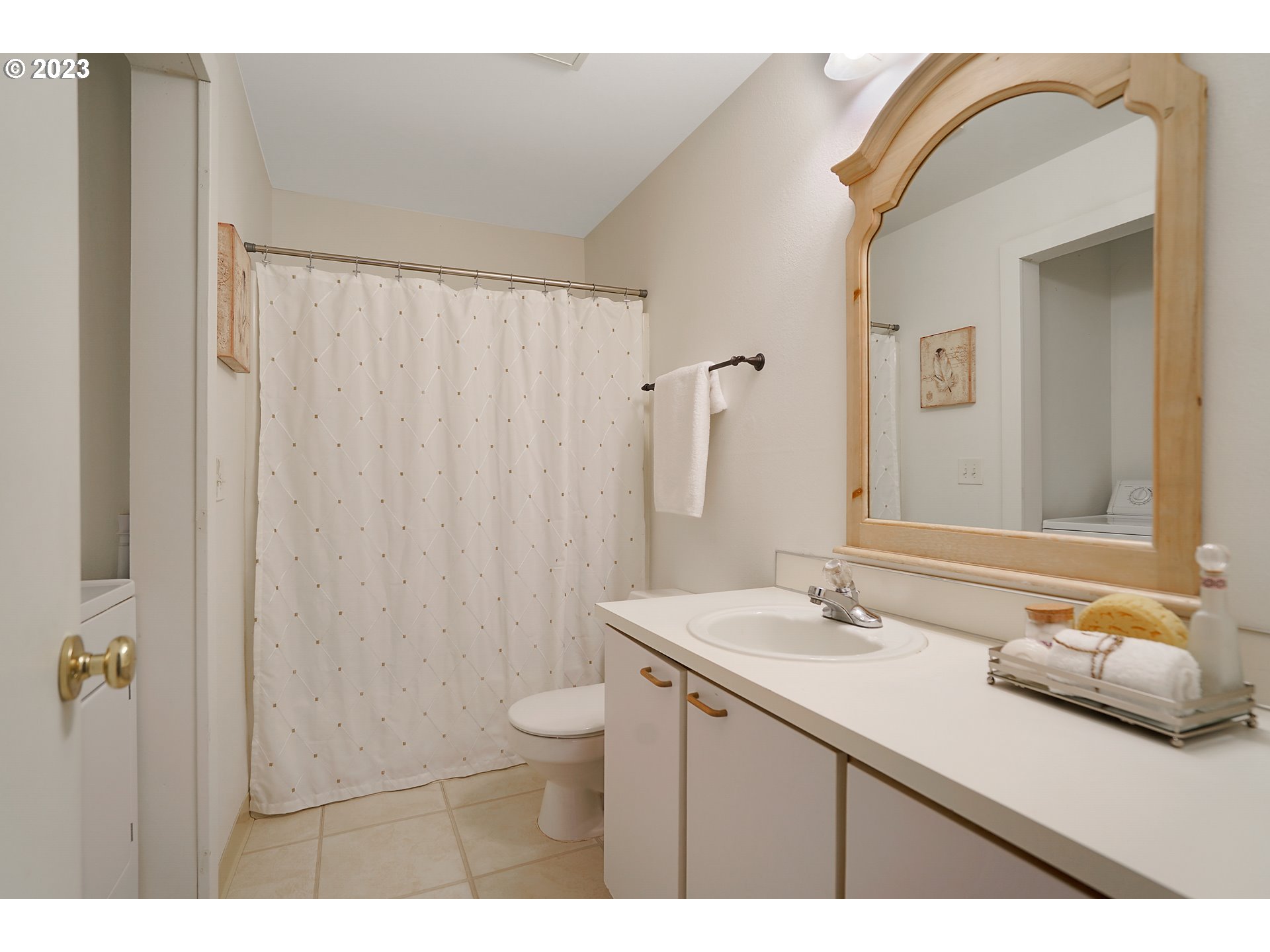 8415 Southwest Curry Drive, Unit A Wilsonville, OR 97070 - Photo 24 of 36 a bathroom with a sink and a mirror