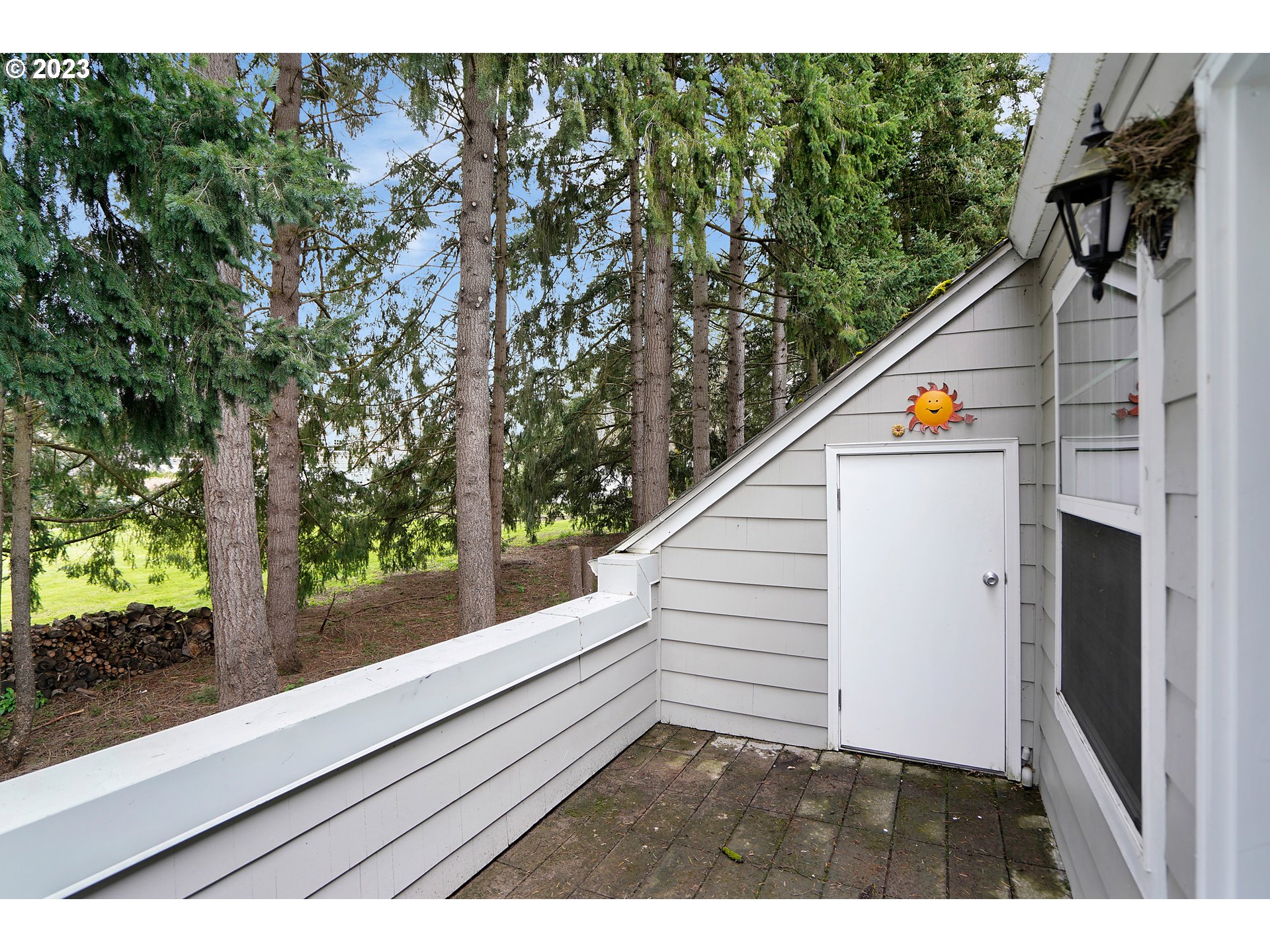 8415 Southwest Curry Drive, Unit A Wilsonville, OR 97070 - Photo 30 of 36 a view of a balcony with floor to ceiling window and stairs