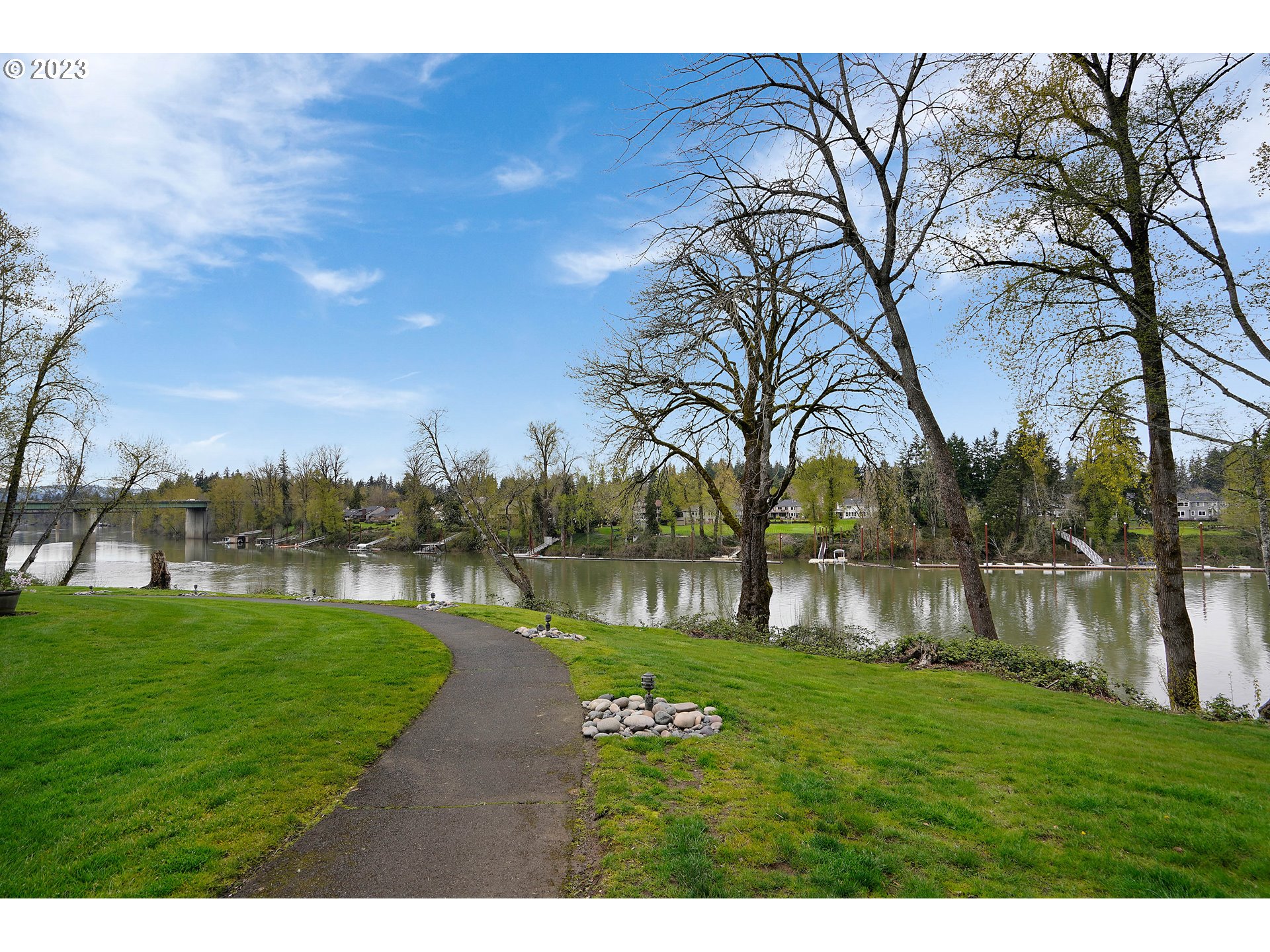 8415 Southwest Curry Drive, Unit A Wilsonville, OR 97070 - Photo 32 of 36 a view of a lake with a big yard